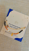 Tobillera doble goldfill multicolor negro y naranja con dije estrella - detalle